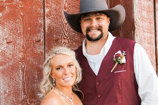 Bride And Groom Next To Barn